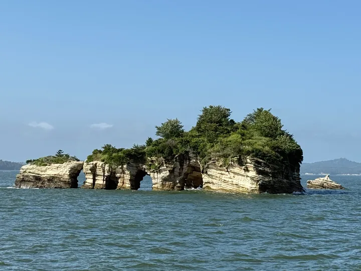 Weathered islets with arch-shaped rocks in Matsushima Bay