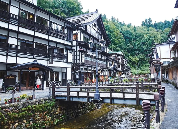 Traditional multi-storey wooden inns along the river in Ginzan Onsen